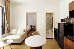 Premium Apartment, 1 Bedroom, Balcony, City View | Living area | 45-inch flat-screen TV with cable channels - GO VILLA - ApartHotel Thao Dien (Ho Chi Minh)