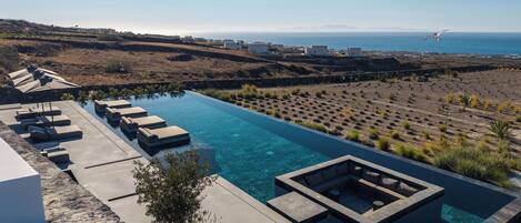 Indoor pool, outdoor pool, pool umbrellas, pool loungers