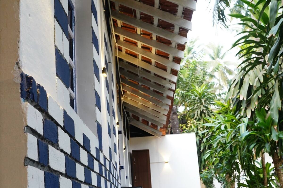 A building with a brick facade and a covered walkway.