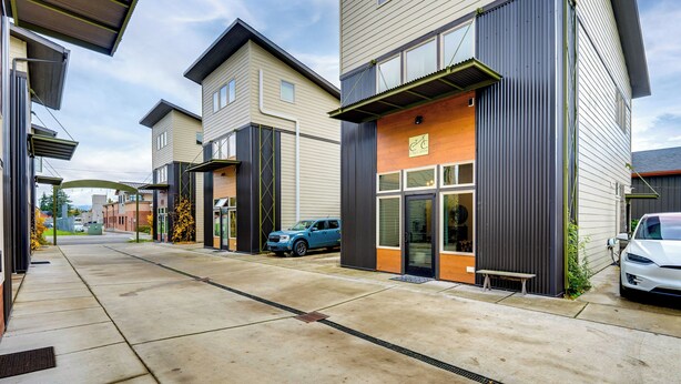 A modern building with a flat roof, large windows, and a visible entrance. - 3 Blocks to Dtwn! Cozy Sedro-Woolley Retreat! (Sedro-Woolley)