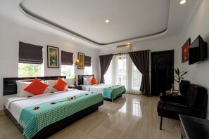 Family Triple Room, Balcony, City View | Minibar, in-room safe, desk, free WiFi