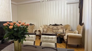 Luxury Apartment, Balcony, City View | Living area | 80-inch Smart TV with cable channels - 2-Bedroom Apartment by Sweet Home (Yerevan)