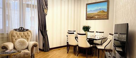 Luxury Apartment, Balcony, City View | Living area | 80-inch Smart TV with cable channels