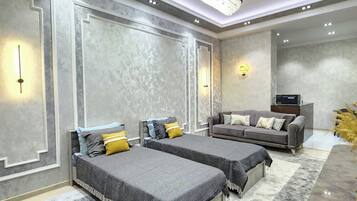 Apartamento conforto, várias camas, cozinha, vista para a cidade | Área de estar | TV LED 42 polegadas com canais digitais