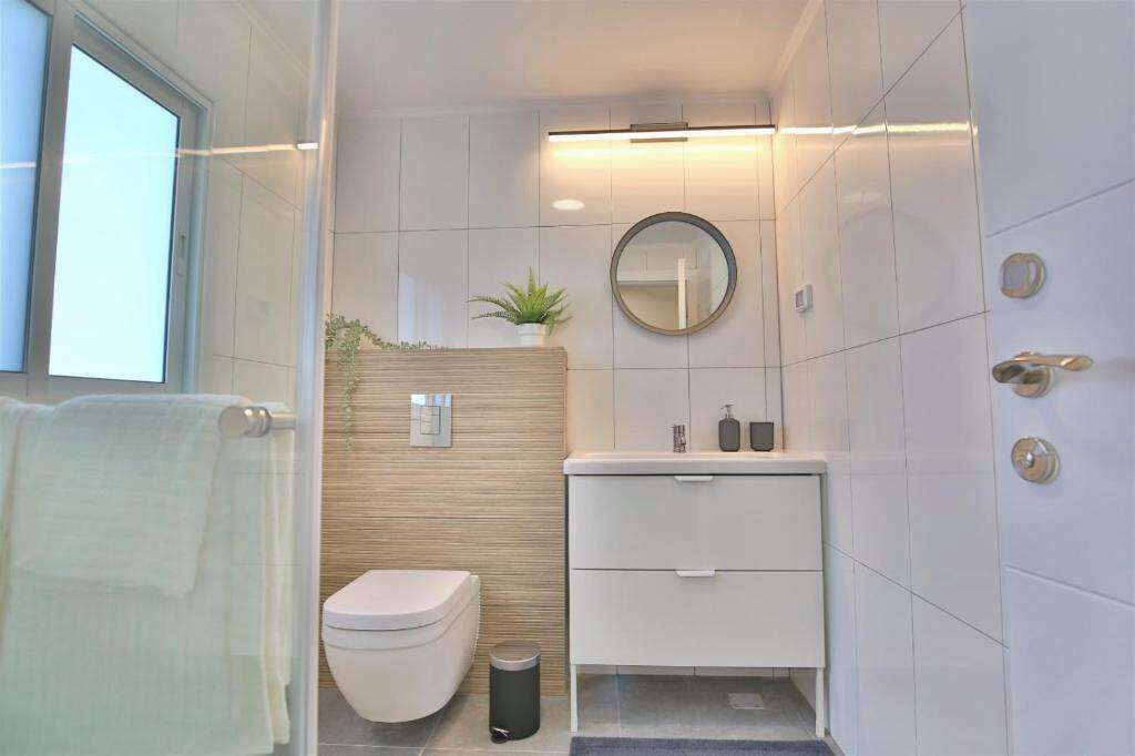 Apartamento conforto | Banheiro | Chuveiro, secador de cabelo, toalhas de banho, sabonete