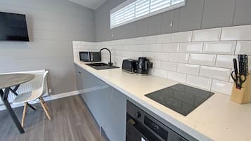 Fridge, toaster, high chair, cookware/dishes/utensils