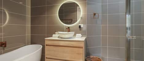 Shower, hair dryer, towels, shampoo