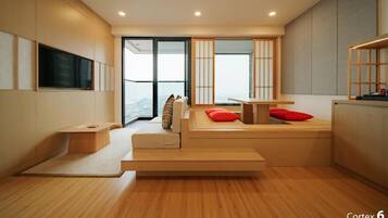 A modern, minimalist room with a built-in bench and a small table, a sliding glass door leading to a balcony, and a large window with a view.