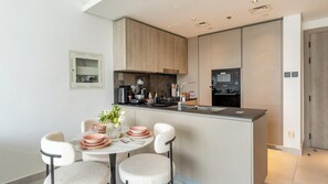 Dining - Manzil - 1BR Apartment in JVC with Pool  (Dubai)