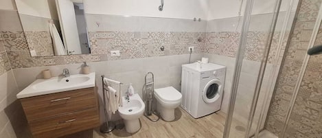 Shower, bidet, towels, soap