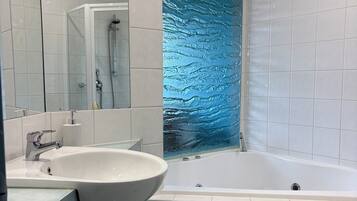 Jetted tub, hair dryer, towels, soap