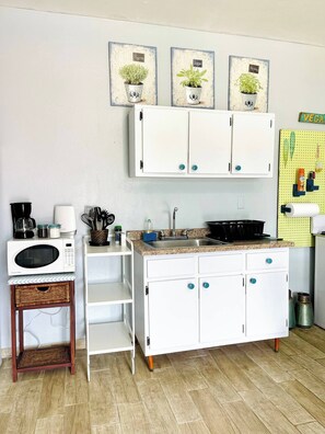 Fridge, microwave, stovetop, coffee/tea maker