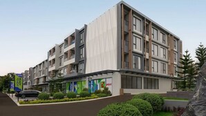 A multi-story hotel with a modern design, featuring balconies and large windows. - Luxury Brand-new Apt in Low-Density Villa, Pool View near the Old town & Airport (Pa Daet Sub District , Mueang District)