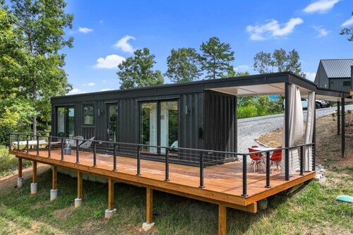 Sleek modern design meets mountain serenity in this 2BR luxury container. Enjoy a private deck and access to pool, hot tub, sauna, and gym for the perfect spring escape.