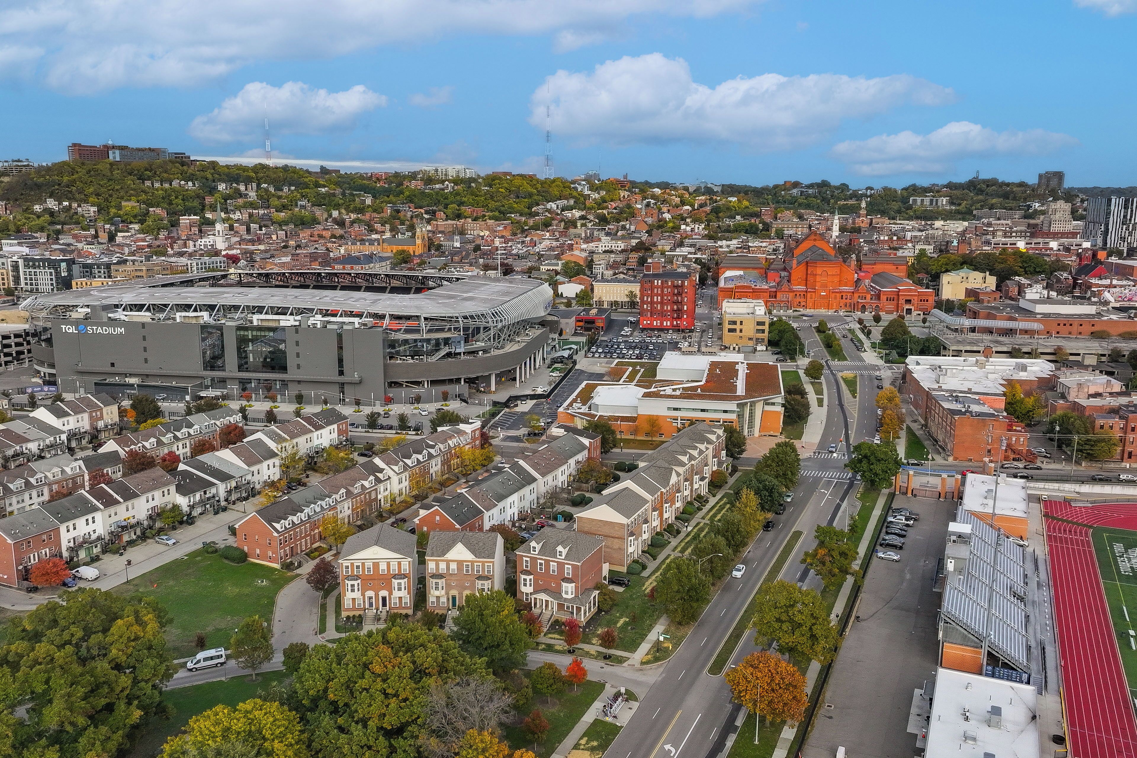 A residential area with a stadium and a church.