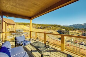 A balcony with a view of a mountainous landscape, a grill, and outdoor seating. - < 5 Mi to Winter Park: Family Base Camp w/ Hot Tub (Fraser)