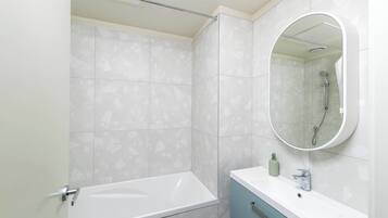 Shower, hair dryer, towels, shampoo