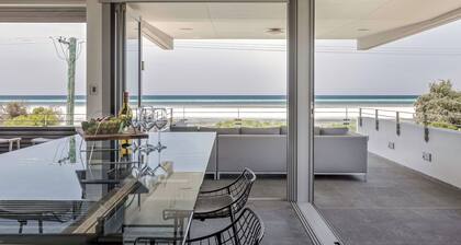 STUNNING TWO-STOREY HOME PERFECTLY POSITIONED IN A PRIME BEACHFRONT LOCATION