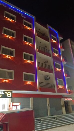 A multi-story building with a red facade and balconies. - Rose Hotel Hurghada 2 (Hurghada)