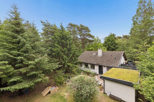 Modernised 70s cottage in forest near beach