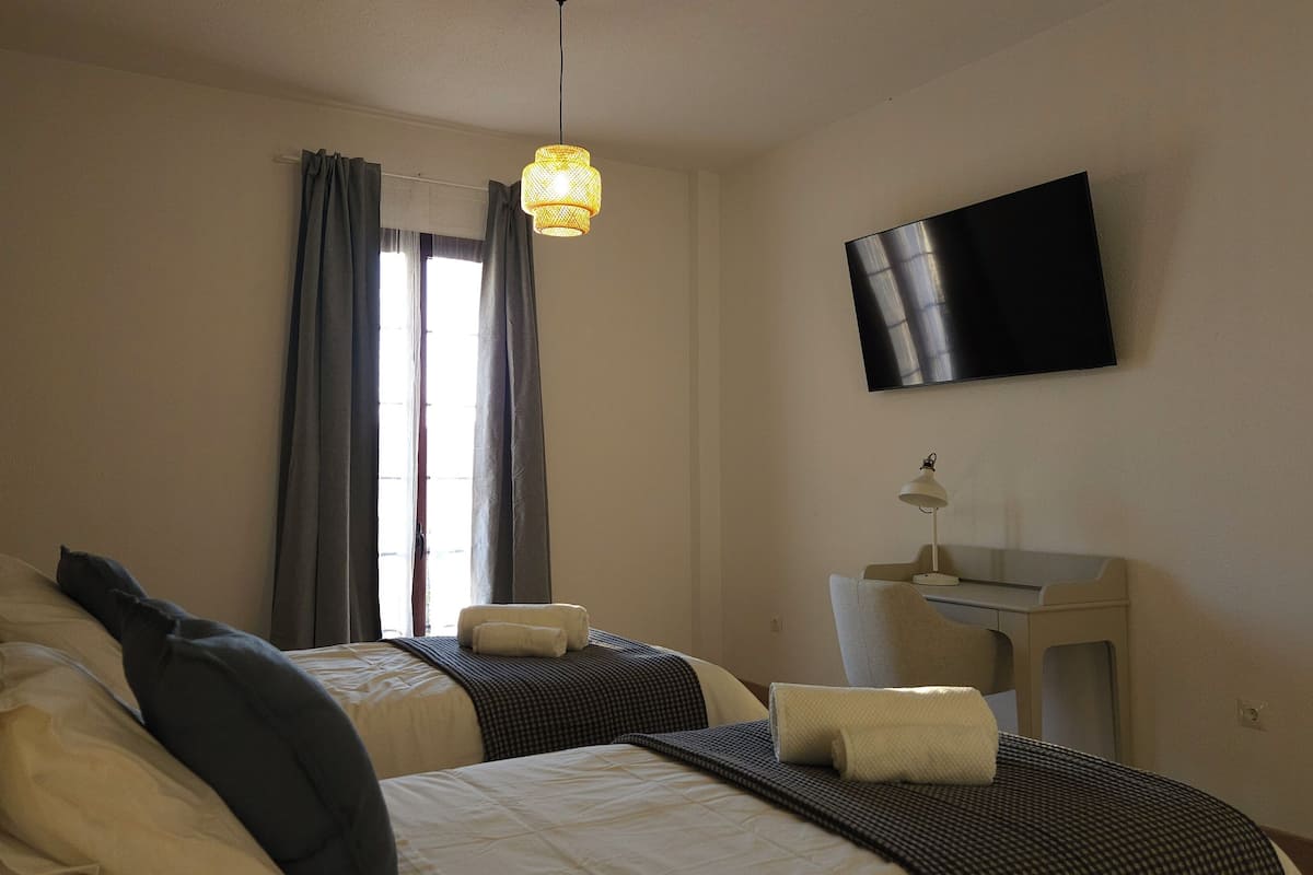 Twin Room, Balcony, Mountain View | Desk, laptop workspace, blackout drapes, free WiFi