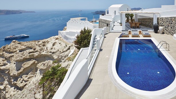 A rooftop pool with a view of the sea and a cruise ship in the distance. - Magnificent Santorini Villa | Villa Aphrodite’s Dream | 2 Bedrooms |. (Santorini)