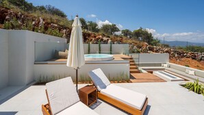 A rooftop terrace with a hot tub, lounge chairs, and a view of the surrounding landscape. - Elegant Crete Villa | Villa Cretan Soul | 5 Bedrooms | Prviate Pool |. (Crete)