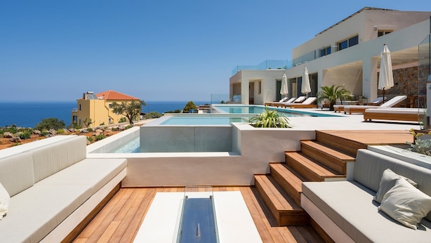 A rooftop pool area with a clear view of the sea, wooden deck, and modern outdoor seating. - Elegant Crete Villa | Villa Cretan Soul | 5 Bedrooms | Prviate Pool |. (Crete)
