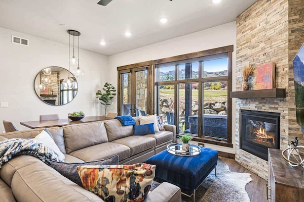 Relax in a spacious living and dining area and view the ski slopes