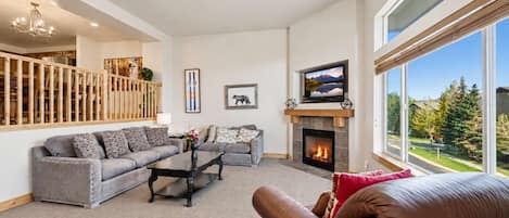 Spacious Living room with easy access to garage and front entry.