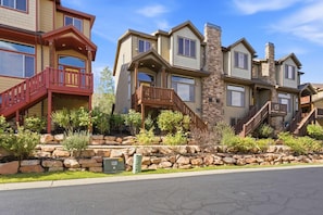 A row of multi-story residential buildings with balconies and stone accents. - Bears Lair | Private Hot Tub & Mountain Views (Park City)