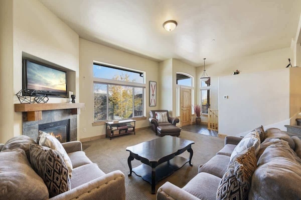 Spacious Living room with easy access to garage and front entry