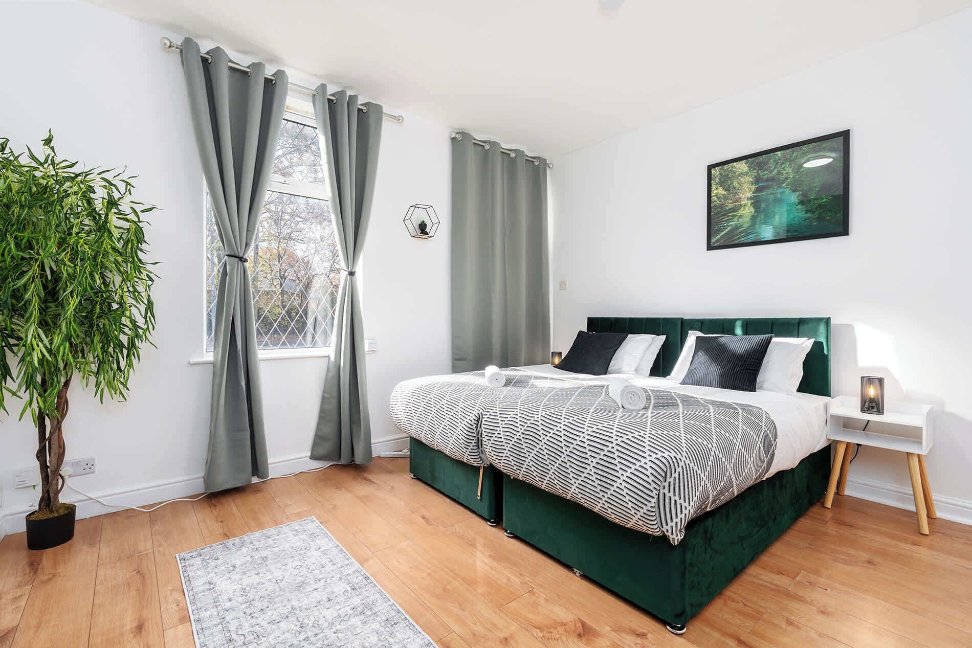 Large double bedroom filled with natural light – perfect for relaxing after work.