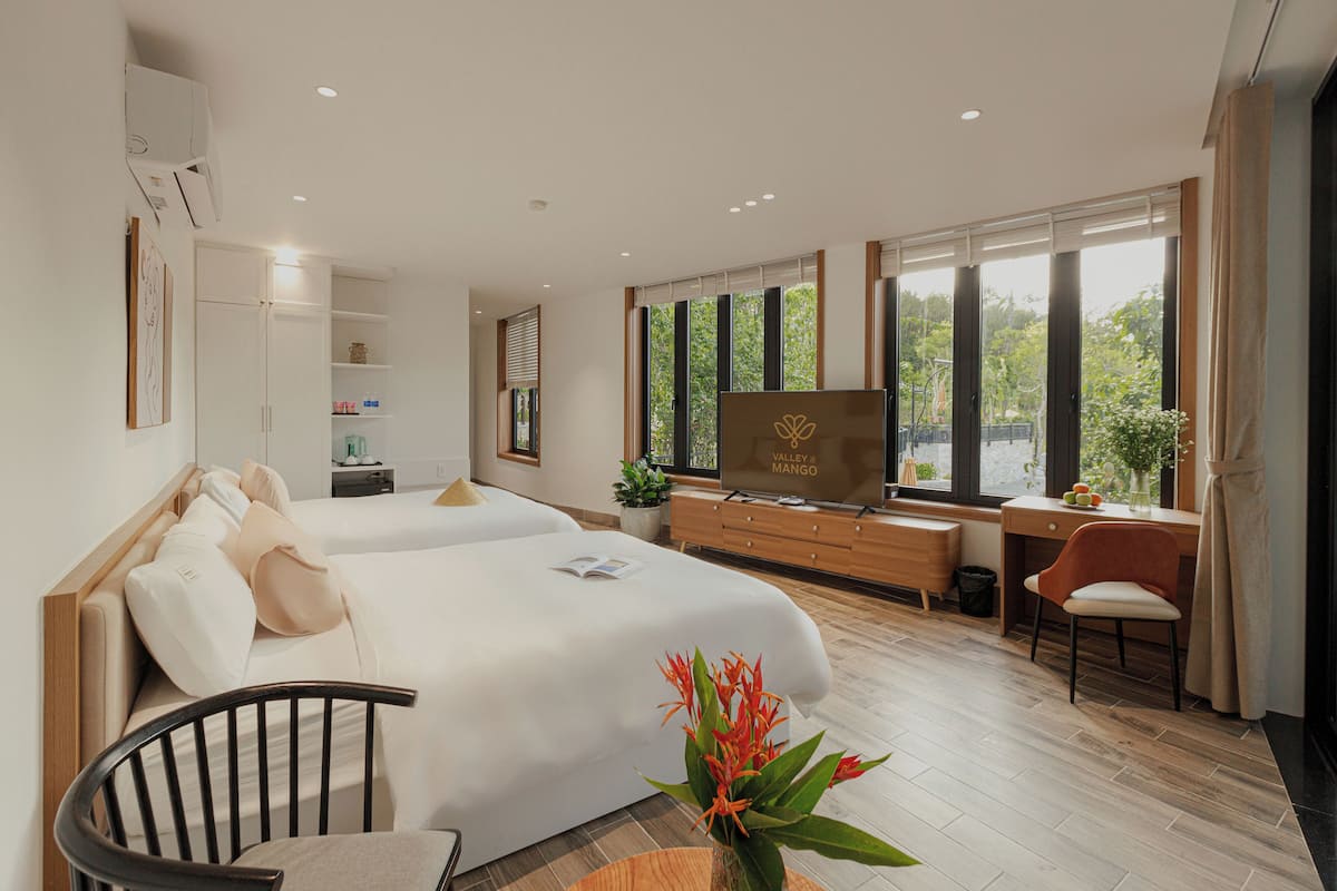 Junior Suite, Patio, Garden View | In-room safe, desk, laptop workspace, blackout curtains