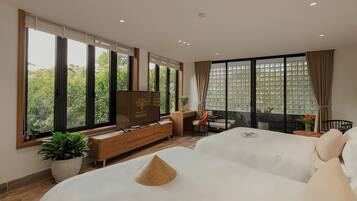 Junior Suite, Patio, Garden View | In-room safe, desk, laptop workspace, blackout curtains