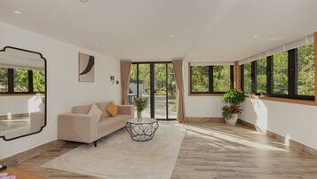 Deluxe Twin Room, Patio, Garden View | In-room safe, desk, laptop workspace, blackout curtains