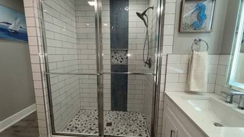 Shower, hair dryer, towels, soap