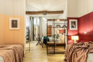 A hotel room with a bed, a bedside table, a lamp, and a wardrobe. - Wine Apartments Florence Biancone (Florence)