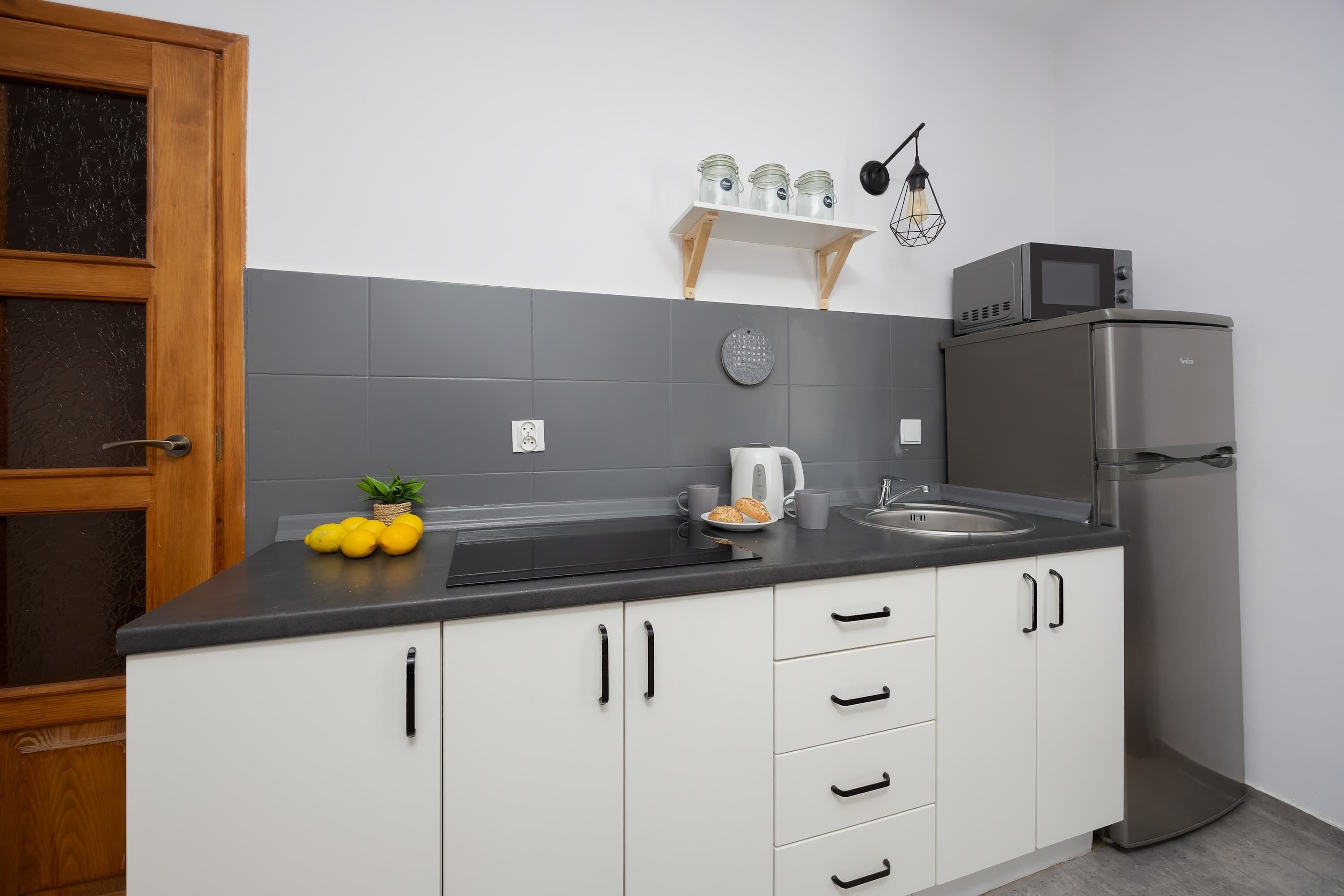 Fridge, microwave, stovetop, cookware/dishes/utensils