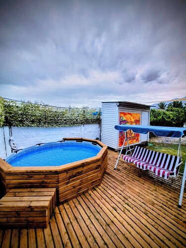 Oasis with swimming pool and spectacular view of the Andes Mountains.