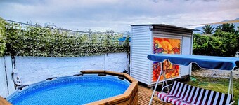 Oasis with swimming pool and spectacular view of the Andes Mountains.