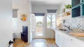 Interior - Spacious 2BR/2BA in the heart of Little Havana—steps to Calle Ocho, walk to local cafés, culture, and nightlife. Enjoy a stylish, fully equipped stay, with balcony, fast WiFi, and free parking.  Second Floor Walk-Up Unit. (Miami)