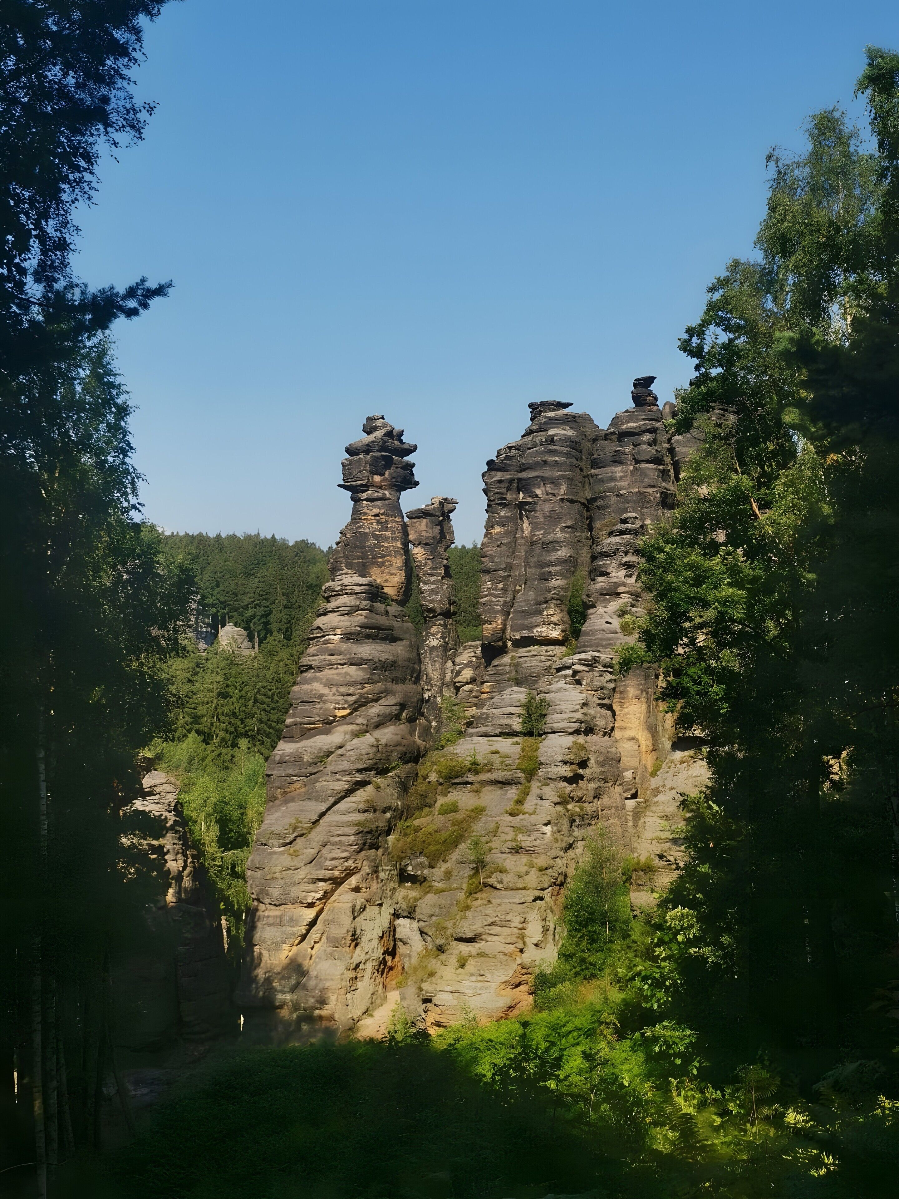 A natural rock formation with a clear sky.