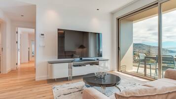 Deluxe appartement, uitzicht op zee | Woonruimte