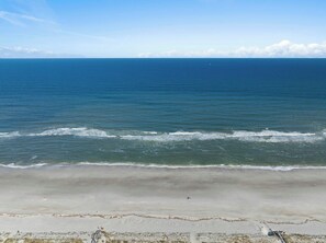 A beach with a clear view of the ocean and a sandy shoreline. - Jax Beach Pet-Friendly Home, Walk to Beach (Jacksonville Beach)