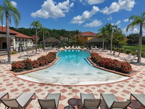 A pool area with lounge chairs and a gazebo. - 4BR Pool Home w/ Lake View Bella Vida (Kissimmee)