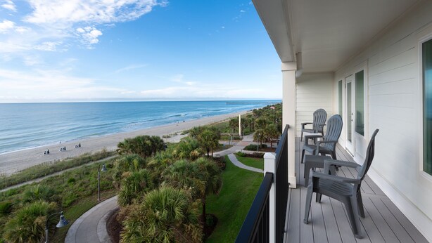 A balcony with a view of the beach and ocean. - Winter Rental for Modern 3 Bedroom in Heart of MB + 100 Dollar Resort credit (Myrtle Beach)