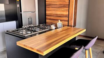 Microwave, blender, cookware/dishes/utensils, kitchen islands