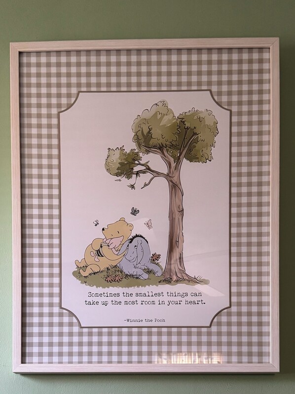 A framed Winnie the Pooh illustration with a quote.