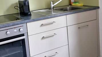 Fridge, oven, coffee/tea maker, cookware/dishes/utensils